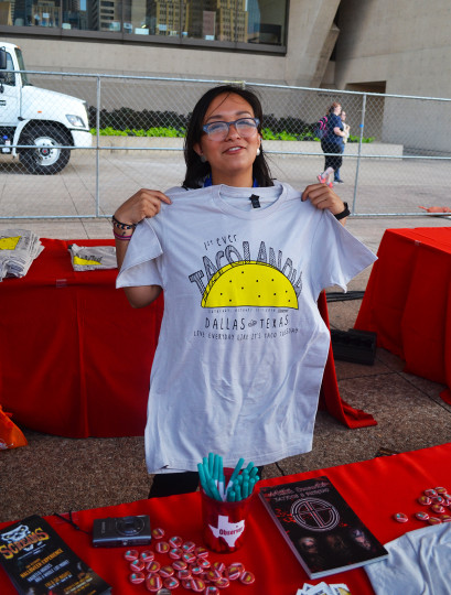 One of the cool kids at the Dallas Observer Table holding an awesome Tacolandia Tee.