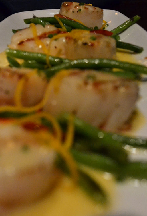 Luscious and soft with a rich tarragon citrus buttery sauce, sweet peppers and haricots verts, the grilled sea scallops were one my favorite dishes.